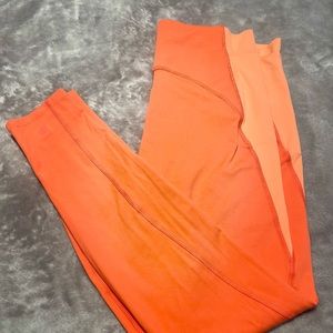 Salmon colored XL leggings.